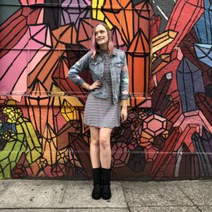 Kristina Horner in front of iconic instagram wall in Seattle